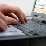 Man's hands on the keyboard of laptop Man's hands on the keyboard of laptop