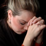 a woman is praying to god with hope