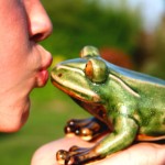 kiss afrog Closeup of lips kissing a big green frog. Don't sell false hope.